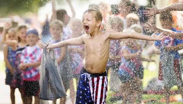 Getting wet at Waverlyfest parade, 2014